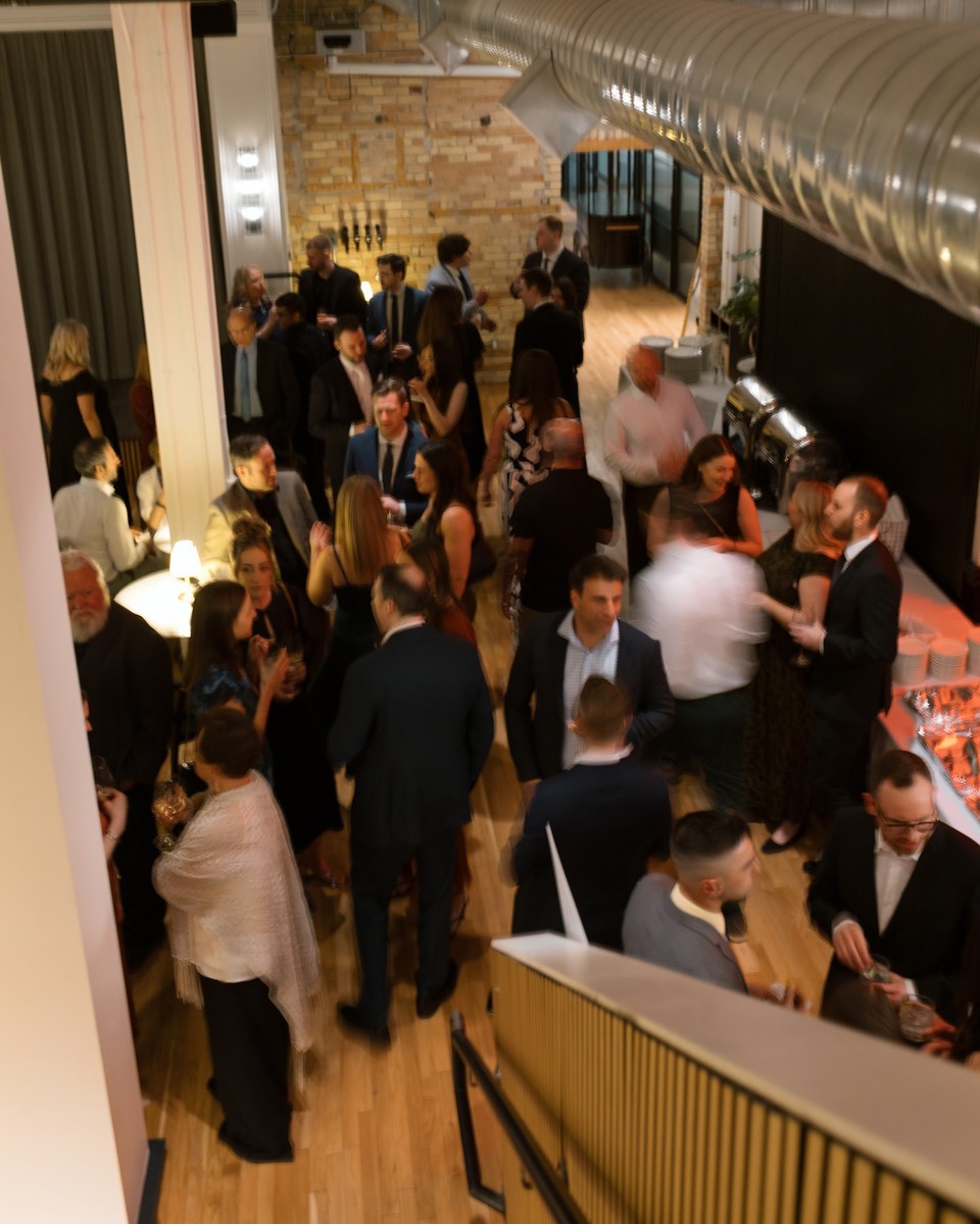 Guests gathered at a reception at Den 1880