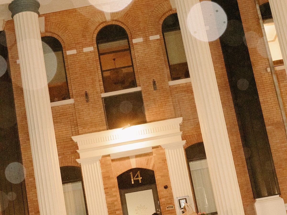 The colonnade and front entrance of Den 1880 at night